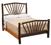 Angled view of the Uncompahgre Peak Hickory Sunburst Bed with white bedding showing the hickory sunburst headboard and footboard