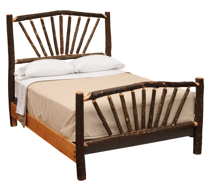 Angled view of the Uncompahgre Peak Hickory Sunburst Bed with white bedding showing the hickory sunburst headboard and footboard