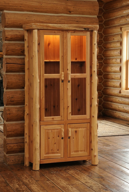 Vermejo Peak Cedar Log Eight Gun Cabinet staged in a sunlit log cabin den