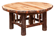 Angled view of the Vermillion Peak Hickory Log Round Coffee Table showing the round hickory top and log base