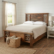 Wetterhorn Barnwood and Hickory Log Bed in a white farmhouse bedroom with a woven basket and nightstand lamp