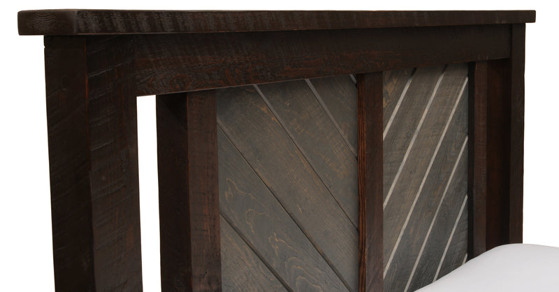 Herringbone panel detail on the headboard of the Wetterhorn Peak Pine Carriage House Bed