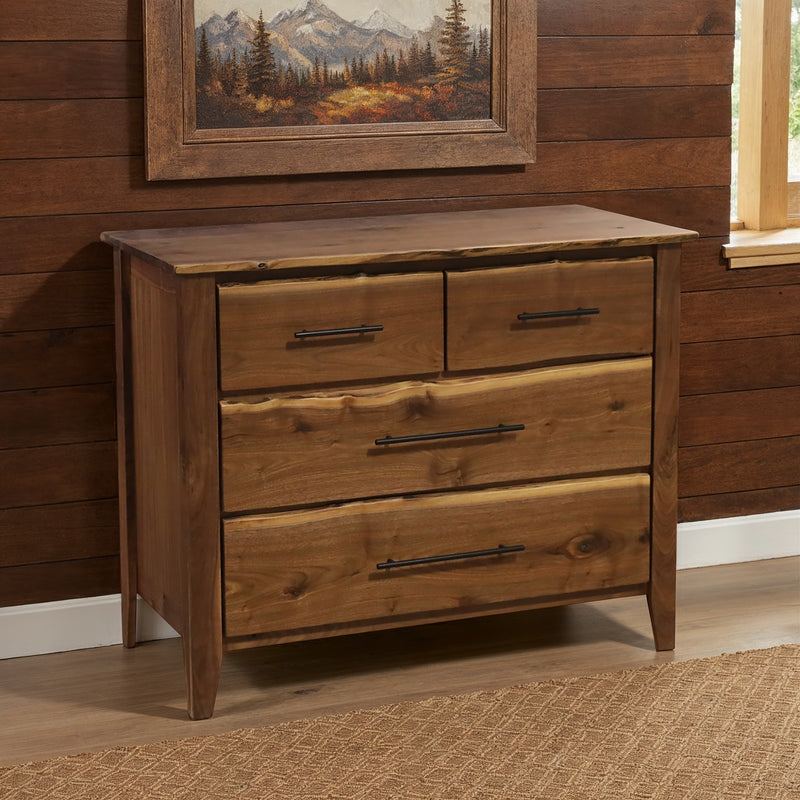Whetstone Mountain Live Edge Walnut Four Drawer Lowboy under a framed painting in a cabin bedroom