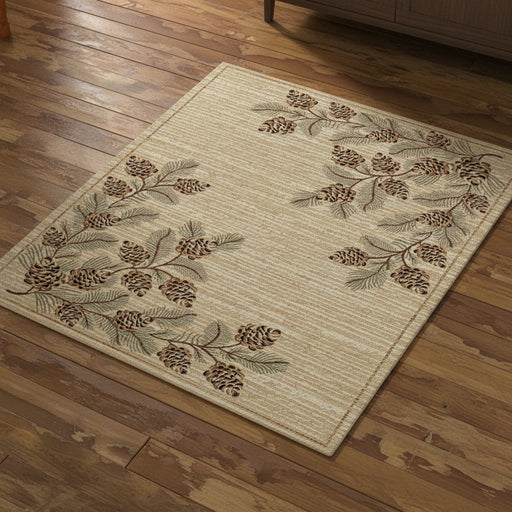 Beige rug with pine cone and branch pattern